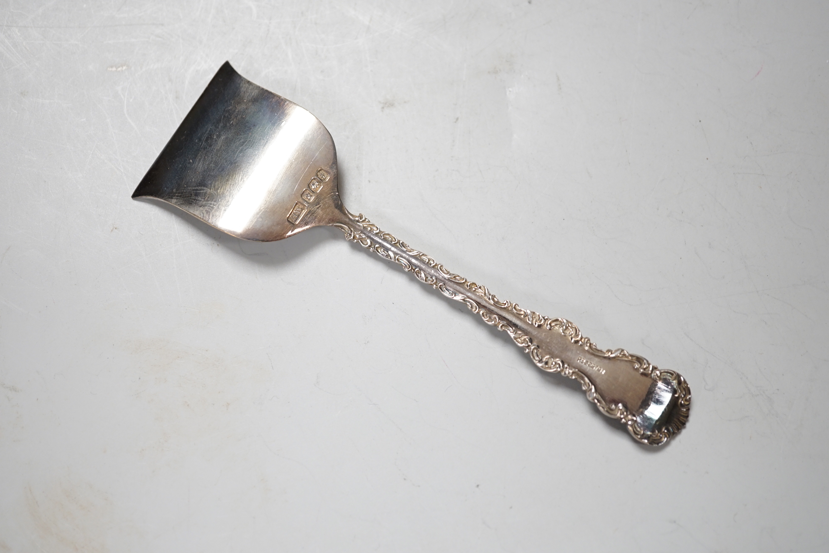 A pair of George V silver mounted cut glass scent bottles, London 1920, 11cm, a similar toilet jar, a hair tidy and a cased two piece christening set